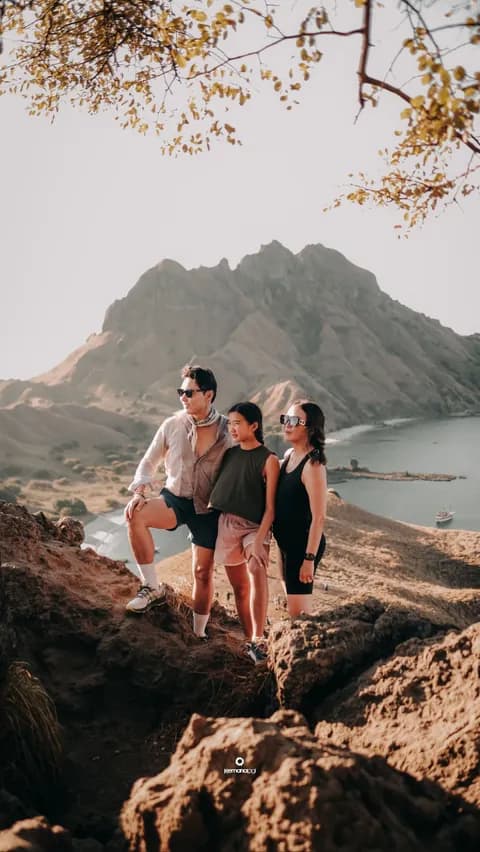 Family trekking the Padar Island viewpoint trail, Komodo National Park