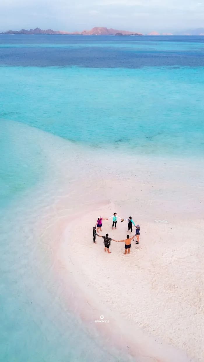 Aerial view of travelers on a Komodo sandbar during a Sailing Komodo tour