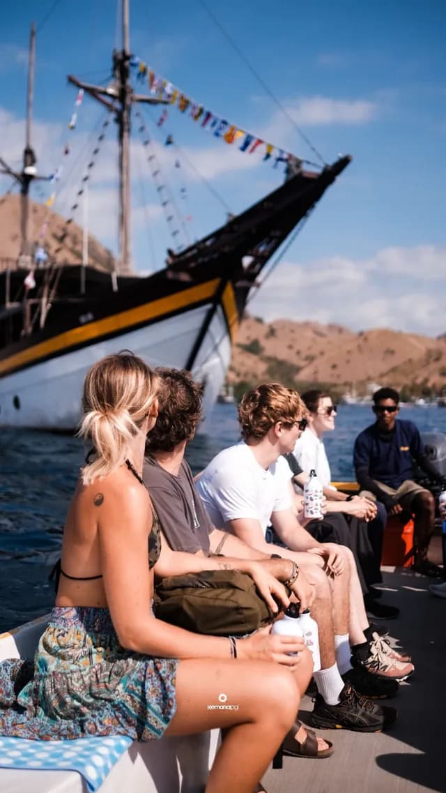 Guests riding a tender boat back to the Phinisi